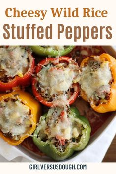 cheesy wild rice stuffed peppers in a casserole dish with text overlay