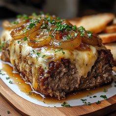 a close up of a plate of food with meat and gravy on it