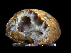 a large rock sitting on top of a glass block