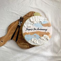 there is a cake that says happy birthday on the plate with a fork and knife next to it