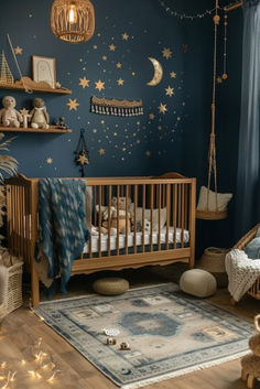 a baby's room decorated in blue and gold with stars on the wall, teddy bear crib