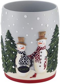 two snowmen are standing next to each other in front of a christmas tree mug