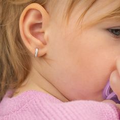 Add some sparkle to your little girls outfits with this beautiful pair of huggie hoop earrings. An extra small pair of huggies that feature beautiful clear cubic zirconia stones throughout the front of the huggie. This fun pair of huggie hoops can be paired with your little one special occasion outfits or can be worn on a regular basis. Created from 14k white gold, these little huggie hoops arrived neatly packaged into a gift box for for easy gifting. Age Group: Lovely for Girls and Preteens; Sa Hypoallergenic White Huggie Jewelry, Modern White Gold Tarnish-resistant Huggie Earrings, White Gold Tarnish-resistant Hoop Huggie Earrings, White Tarnish-resistant Small Hoop Huggie Earrings, White Diamond Huggie Earrings, Fine Jewelry, White Gold Hoops, Baby Earrings, Kids Necklace, Special Occasion Outfits