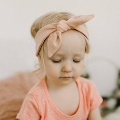 Easily dress up any outfit with this knotted headband. The super-soft stretchy fabric makes it so comfortable for baby she’ll forget she’s even wearing it!>>This Listing Includes:1 x Topknot Headband(Model is wearing Blush)>>SizingNewborn = 14"0-6mo = 15"6-12mo =16"18mo = 17"24mo = 18"3-10yrs = 19"Adult = 21"**PLEASE NOTE** all Canadian orders are shipped via non-tracked lettermail. We are not responsible for any lost or stolen mail. If you would like tracking please choose this upgr Knotted Baby Headband, Toddler Headband, Baby Head Wrap, Baby Hair Accessories, Newborn Headband, Toddler Headbands, Top Knot Headbands, Baby Bow, Handmade Headbands