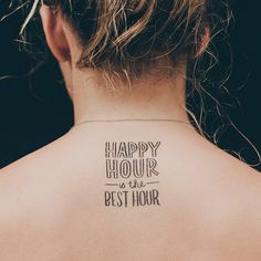 the back of a woman's neck that says happy hour is the best hour