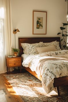 a bed sitting in a bedroom next to a wooden dresser and window with white curtains