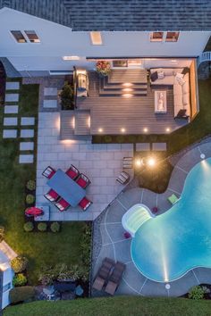 an aerial view of a pool and patio at night