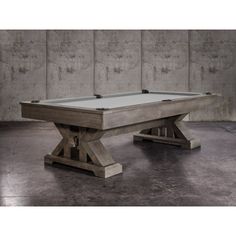 a pool table made out of wood and concrete