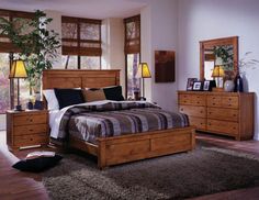 a bedroom scene with focus on the bed and dressers