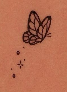 a drawing of a butterfly on the back of a woman's stomach, with bubbles coming out of it