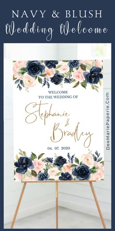 navy and blush wedding welcome sign with flowers on it in front of a white background