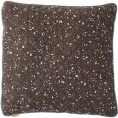 a brown pillow with white speckles on it