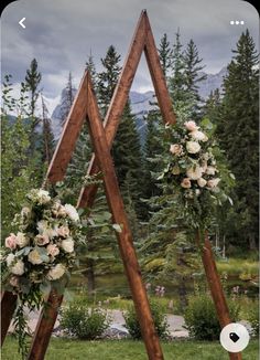 an outdoor ceremony setup with flowers and greenery