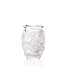 a glass vase sitting on top of a white table