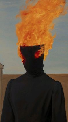 a man with a black hoodie and red eyes is in front of a fire