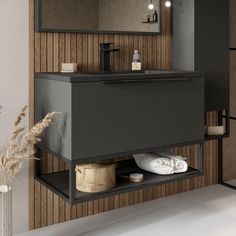 a bathroom with a sink, mirror and towel rack on the wall next to it