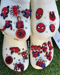 white shoes with spiderman stickers on them