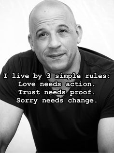 a balding man with a black shirt and white lettering on the front reads i live by 3 simple rules love needs action trust needs proof sorry needs change