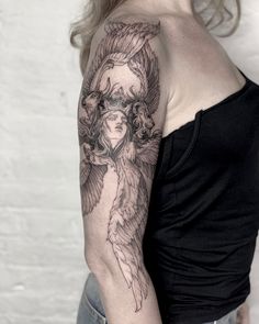 a woman with a tattoo on her arm