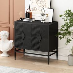 a black cabinet sitting next to a white vase