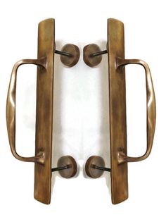 an image of a door handle with two handles on the front and one side, against a white background