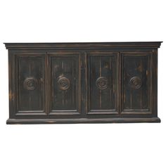 an old wooden cabinet with four doors and three knobs on the front, against a white background