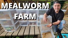 a man kneeling down in front of some containers filled with dirt and other things that are inside