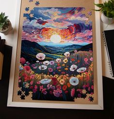 a jigsaw puzzle with flowers in the foreground and a sunset in the background