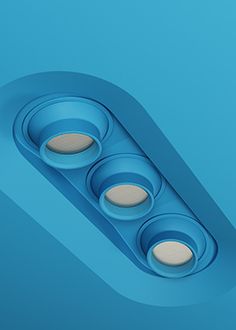 an overhead view of three lights on a blue surface