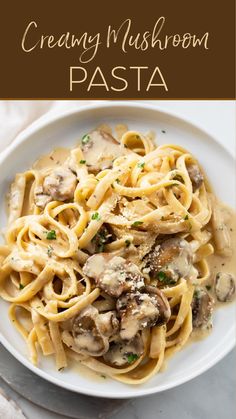 a white plate topped with pasta covered in mushrooms