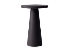 a black table sitting on top of a white floor