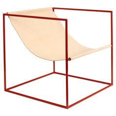 a chair that is sitting inside of a red frame