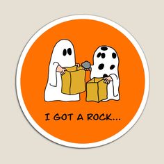 an orange sticker with two ghost holding boxes and the words i got a rock