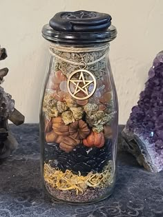 a glass jar filled with rocks and plants