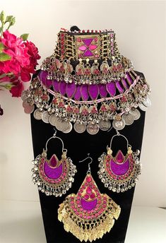 purple Afghan full jewellery set Afghani Jewelry set Afghan Choker Necklace headpiece earrings Kuchi Jewelry afghan jewelry set afghan fashion set includes: -1 chocker necklace  -1 pair of earrings  -1 tikka  Message for any enquiries Our Aim as a business is to connect Afghan women with their roots and to make anyone that purchases our jewellery feel powerful and beautiful as each and everyone of our items is handcrafted with care and love. Bohemian Purple Jewelry For Festive Occasions, Traditional Purple Jewelry For Party, Traditional Purple Jewelry For Festival, Purple Traditional Festival Jewelry, Afgan Jwellary, Afghan Jewellery, Purple Afghan, Afghan Jewelry Necklace, Afghan Jewelry Set