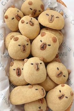 a basket full of cookies with faces on them