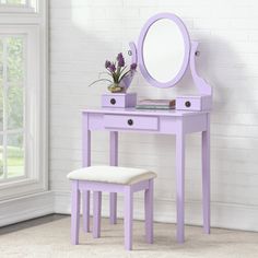 a purple vanity table with a mirror and stool