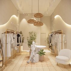 the interior of a clothing store with clothes on racks