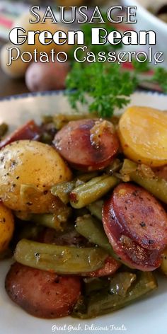 sausage, green bean and potato casserole on a white plate with parsley