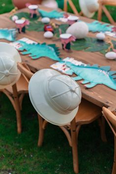 the table is set up with hats on it