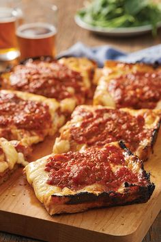 slices of deep dish pizza on a cutting board