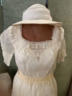 1910 vintage, off white organza wedding dress, beautifully preserved. The  square neck line and the short sleeves are trimmed in two rows of organza ruffles. The skirt is two layers and the top layer has two rows of riffles; the under layer, which is longer, had four rows of ruffles. There is a cream colored grosgrain ribbon that structures the waist line and showers through the sheer fabric. The nylon, full length slip is modern. The white straw hat has organza flowers and an organza double bow White Organza Dress With Ruffles, Spring Vintage Organza Dress, Cream Organza Dress With Lace Trim, Luxury Ruffled Organza Dresses, Flower Dress Design, 1930s Organza Dress, Organza Wedding, Organza Wedding Dress, Organza Flowers