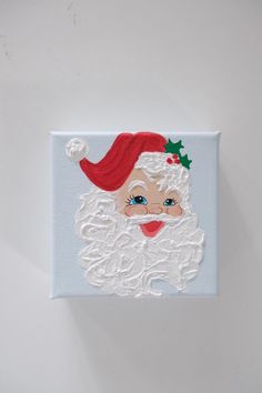 a painting of a santa clause on a white wall