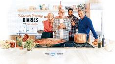 a group of people standing in front of a pizza on top of a stove next to pots and pans