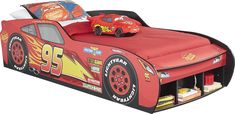 a child's bed with a race car theme