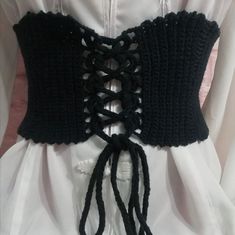 black crocheted corset with ties attached to it