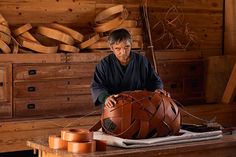 a man is working on a wooden object