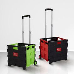 two black and red boxes with wheels on the floor, one is green and the other is red