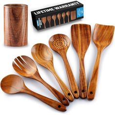 wooden kitchen utensils are lined up next to a box