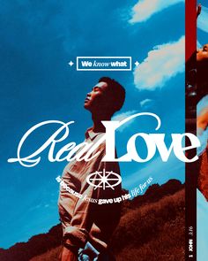 a man standing in front of a blue sky with the words real love on it